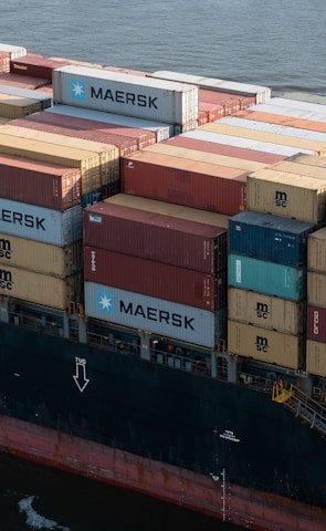 A large cargo ship loaded with containers ready for international shipping.